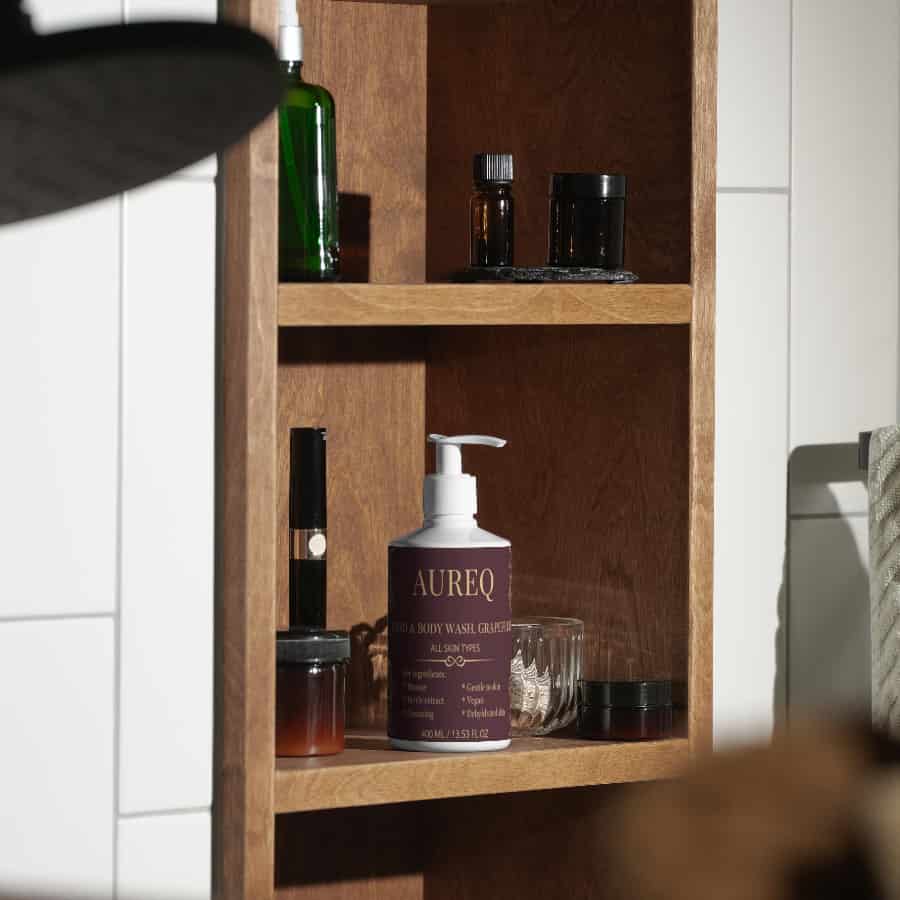 hand & body wash grapefruit AUREQ pump bottle on bathroom shelf, COSMOS Natural certified grapefruit essential oil cleanser