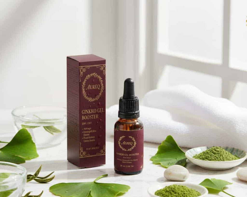 Antioxidant Ginkgo Gel Booster serum bottle and box with ginkgo leaves and green powder, antioxidant ginkgo gel skincare